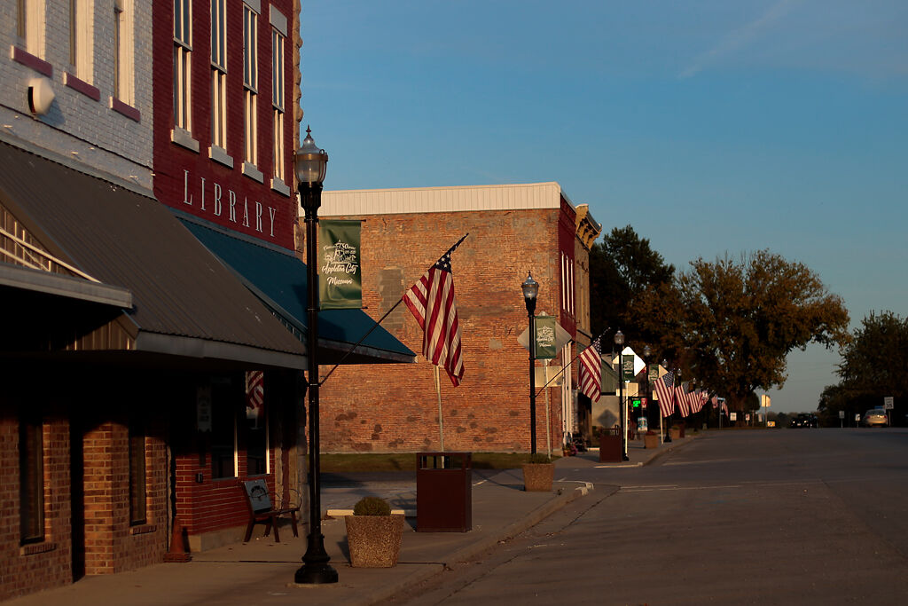 American flags hang in the relatively still evening air on Friday, Oct.2, in Appleton City, Mo.